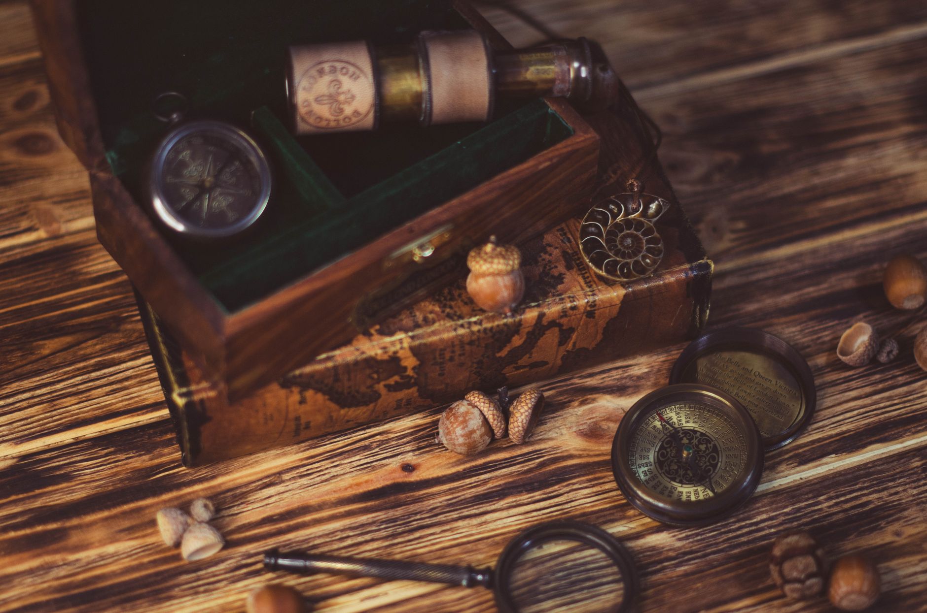 box map compasses and magnifying glass