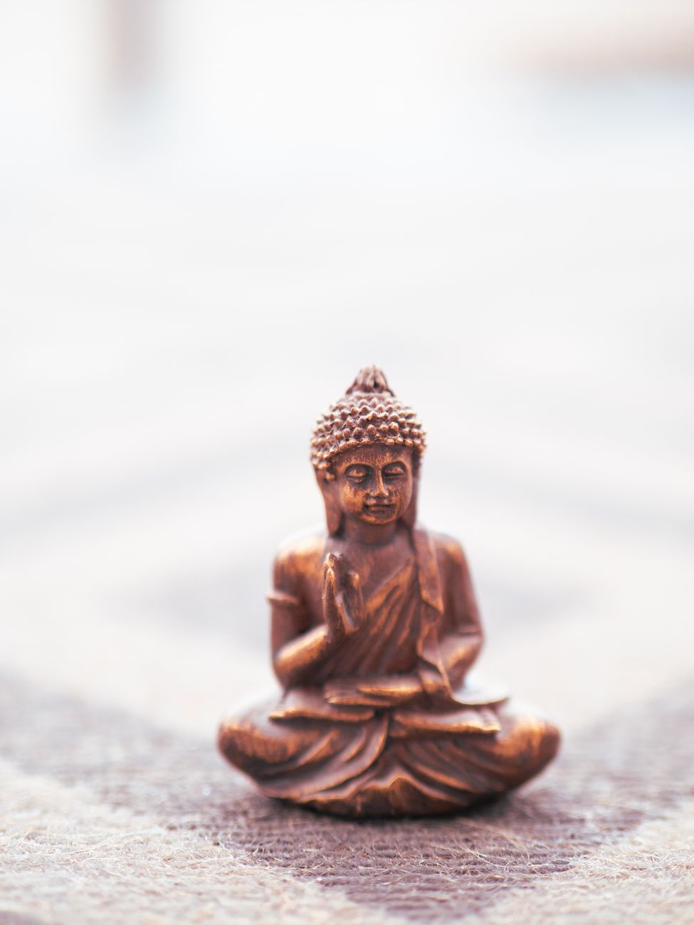 close up of a buddha figurine. Photo by Peter Jochim on Pexels.com